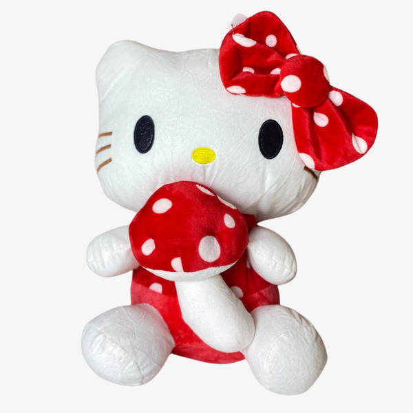 Plush toy of a character with a red and white polka dot dress and bow on a white background