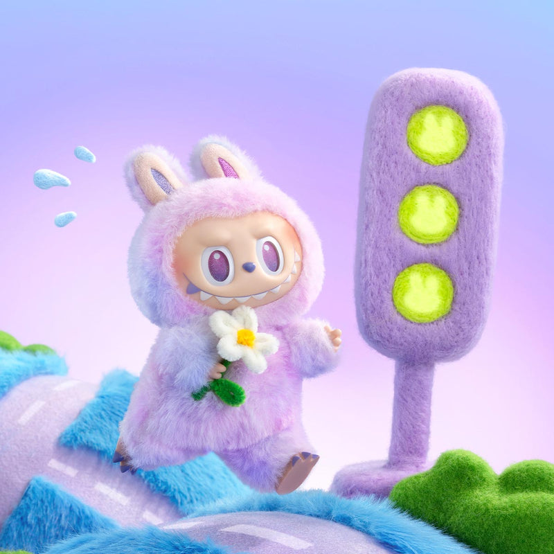 Labubu purple bunny costume holding a flower, standing next to a purple traffic light on a colorful background.